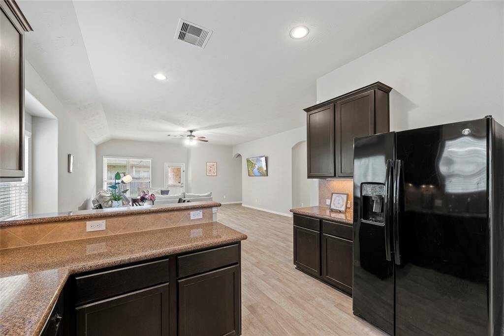 Open-concept kitchen and living area.