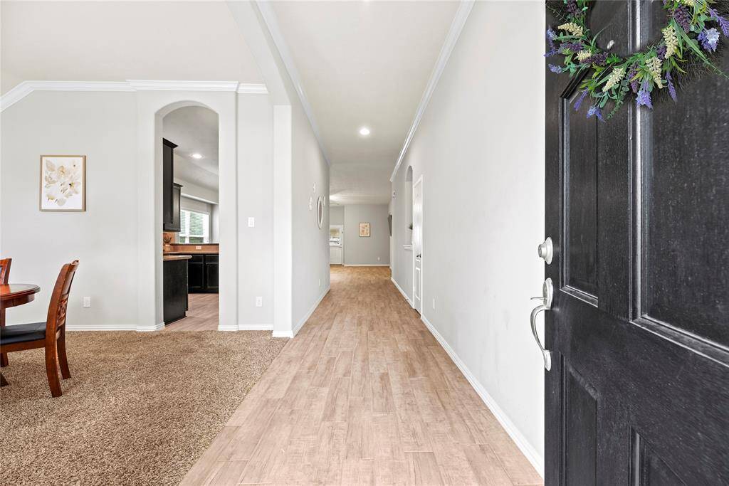 A welcoming entryway with light wood