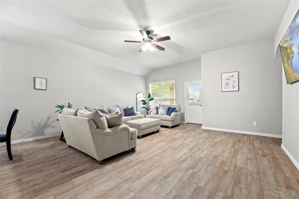 Neutral walls, large windows for natural light with access to the backyard.