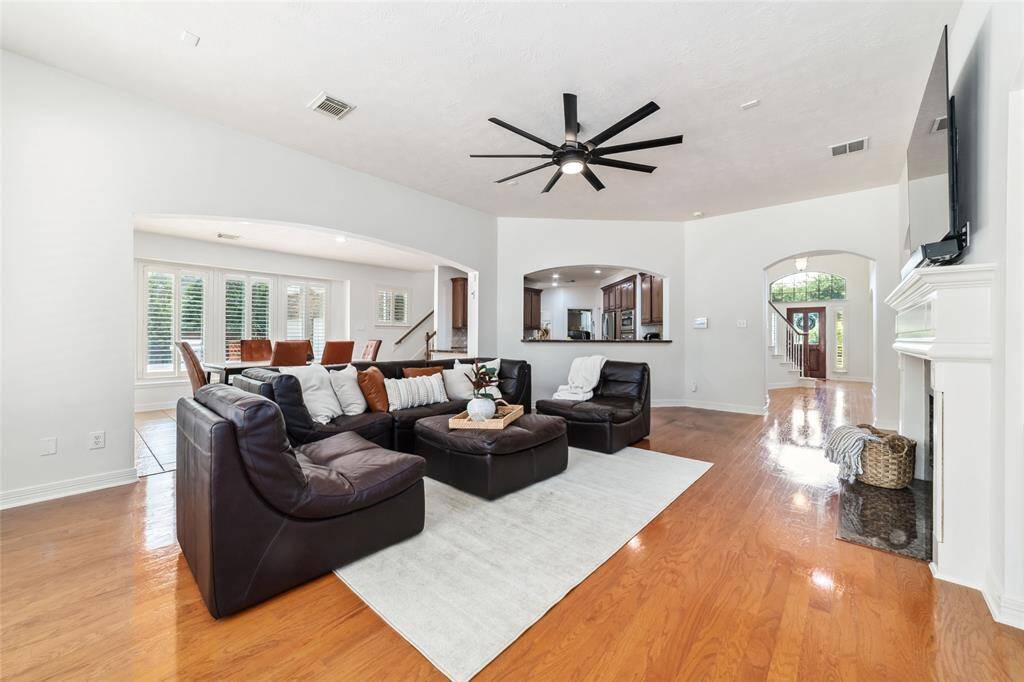 The heart of the home, the living area continues with hardwood flooring, a striking gas log fireplace as well as beautiful and functional built-ins. With the recent interior painting throughout the home, this space feels fresh, light, bright and airy.