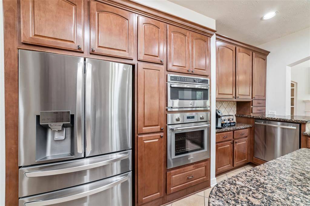 Always a bonus to have double ovens for entertaining! The upper is a convection/rotisserie/microwave and the lower is a conventional Thermador oven. You'll also enjoy the stainless steel, raised dishwasher.