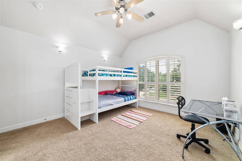 The second of the four upstairs bedrooms, with views of the front lawn. All of the bedrooms offer generous sized closets.