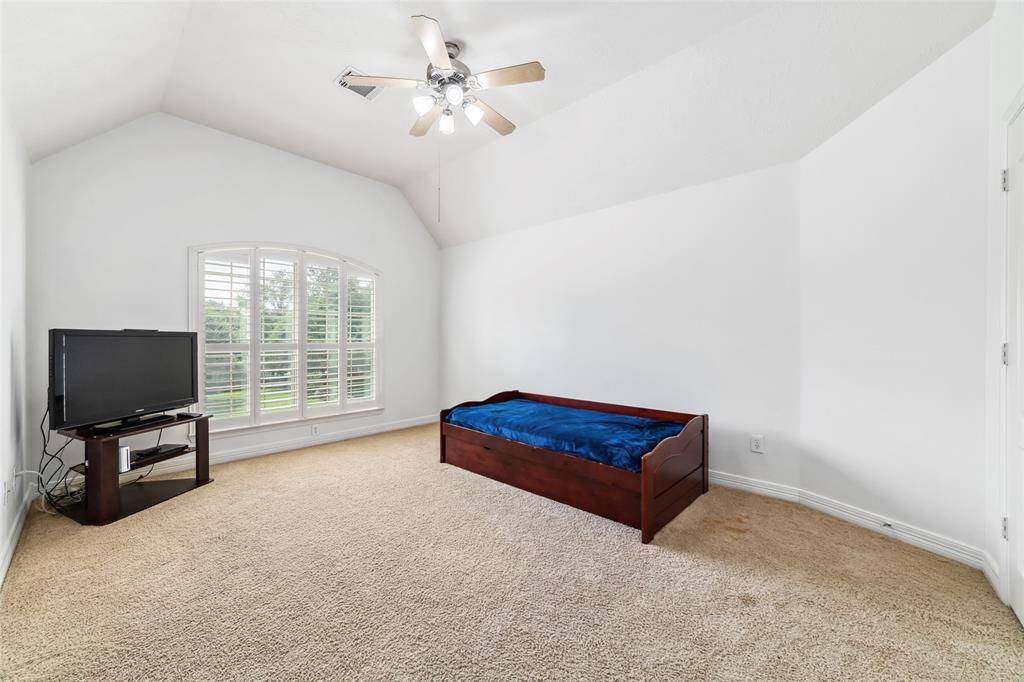 The third of the four upstairs bedrooms. This bedroom also overlooks the front lawn.And each room is flooded with abundant, natural light.