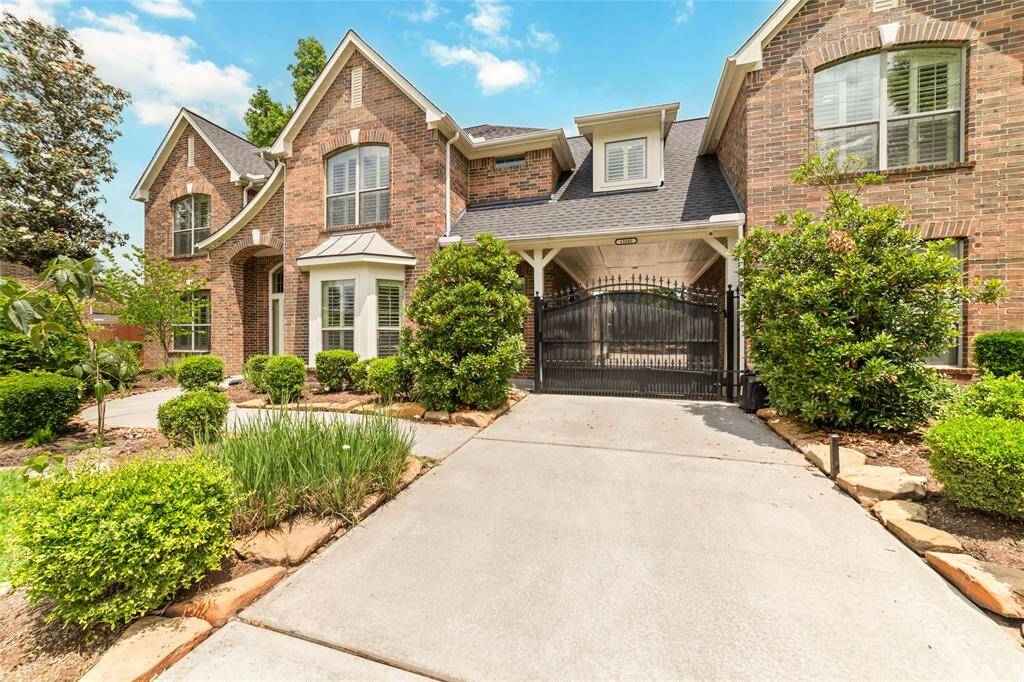 The extended driveway with porte-cochere and electronic driveway gate provides convenience, privacy and security. This home has a true 3 car garage and large motor court for overflow parking.