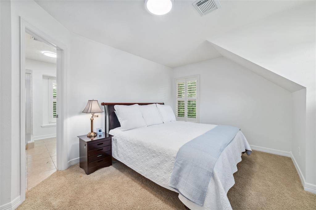 The final of the four upstairs bedroom is oversized, with beautiful windows, complete with its en-suite bathroom. This is truly a perfect second primary bedroom suite or could be a relaxing guest suite, tucked away on the upper right side of the home.