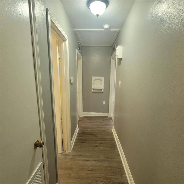 Hall to bedrooms notice the fresh paint & nice floors