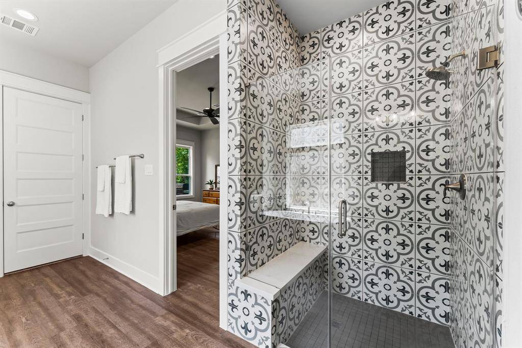 Primary Bathroom also features a separate, seamless walk-in shower with designer tile.