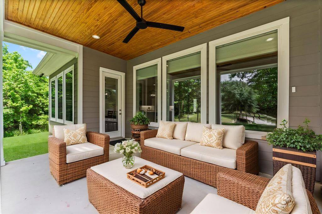 Covered back patio provides the perfect shaded escape, ideal for outdoor dining or relaxing with your morning coffee. (Virtually Staged)