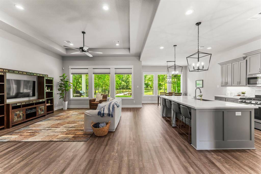 The layout provides a seamless blend of the Living, Dining, and Kitchen areas.