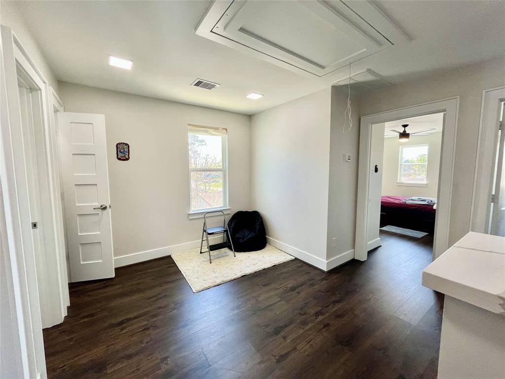 Upstairs game room connecting three bedrooms on the second floor of 13505 Orleans A