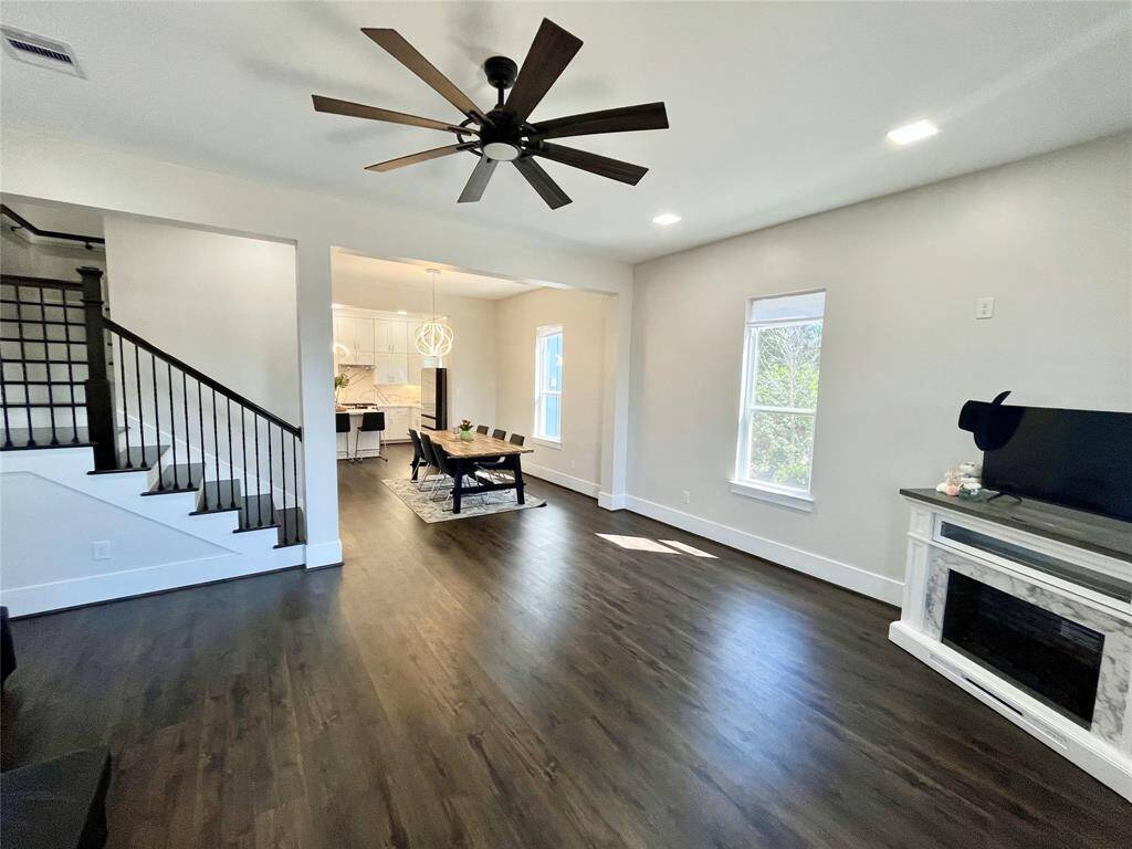 Vinyl plank flooring all throughout 13505 Orleans A; the electric fireplace is ideal for warming the living room