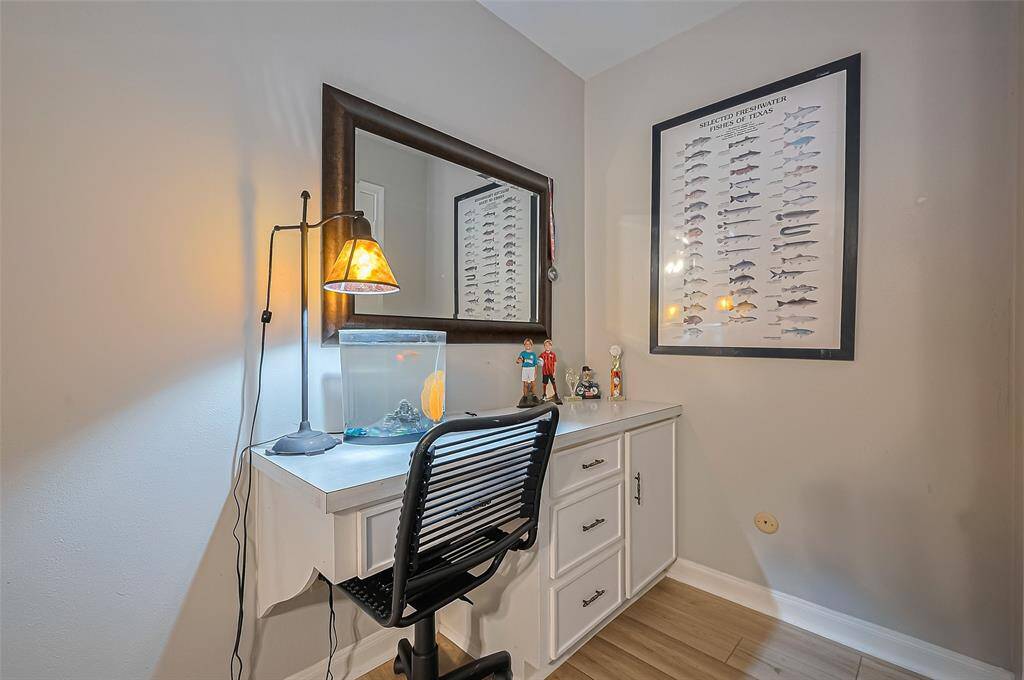 This room has a built in desk and walk in closet.