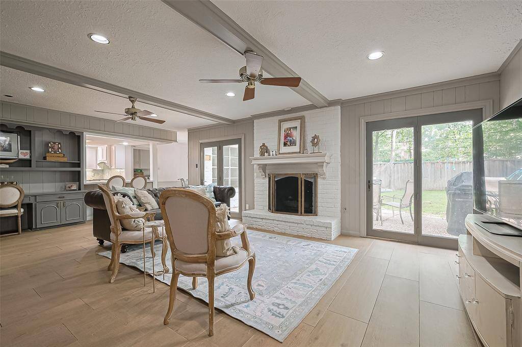 Generous size living room with a beautiful fireplace. Great for entertaining.