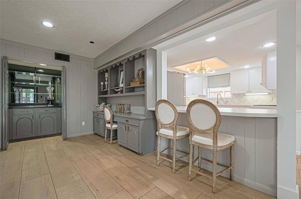 the kitchen is open to the living room and there is a wet bar which is great for entertaining.
