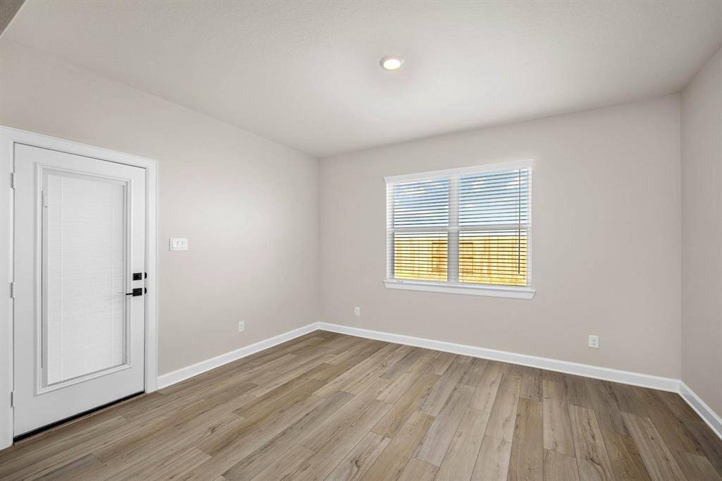 The dining room flows out to the back covered patio.