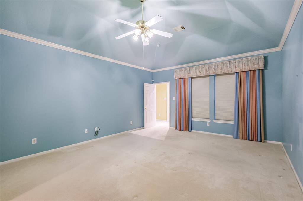 Primary bedroom is on the opposite side of the house from other bedrooms. This provides plenty of privacy.
