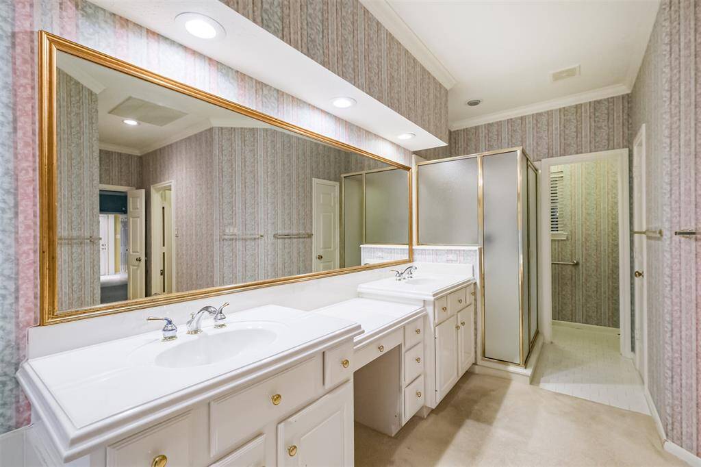 large ensuite with double sinks and dressing area.