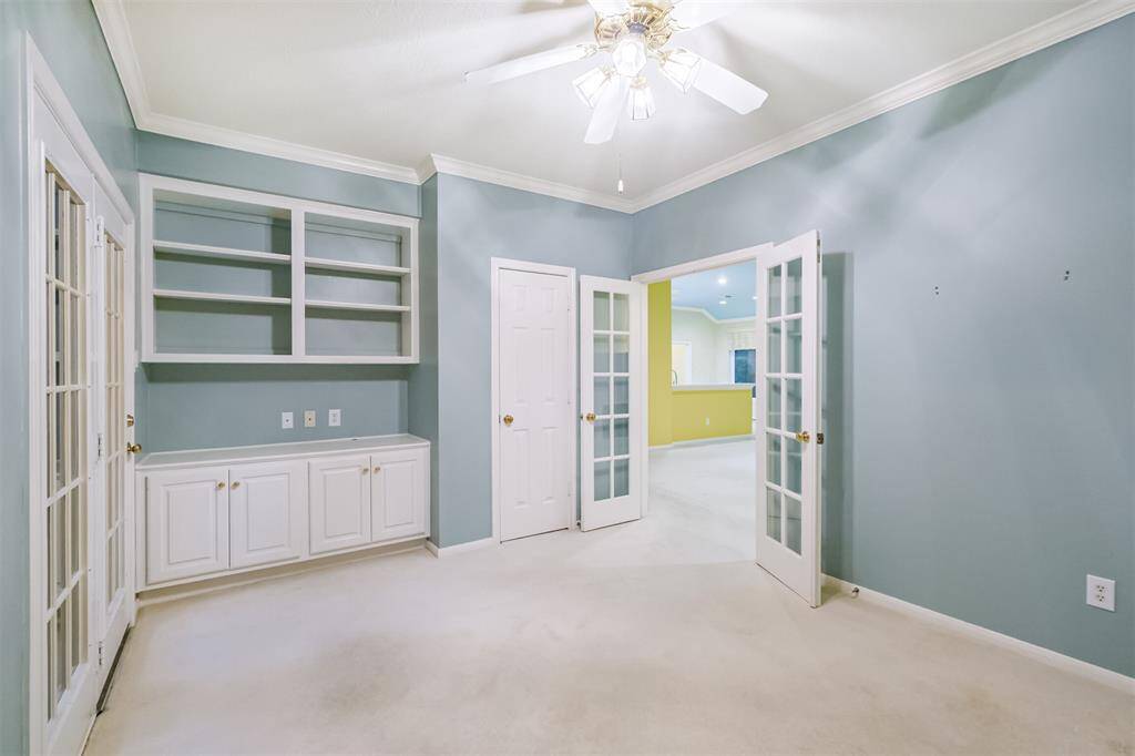 Study has shelves and built-in cabinets for great storage. Opens to the atrium allowing natural light.