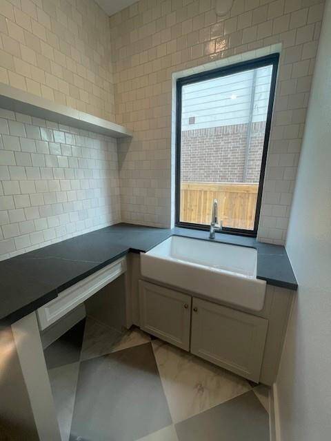 Laundry room with exterior window