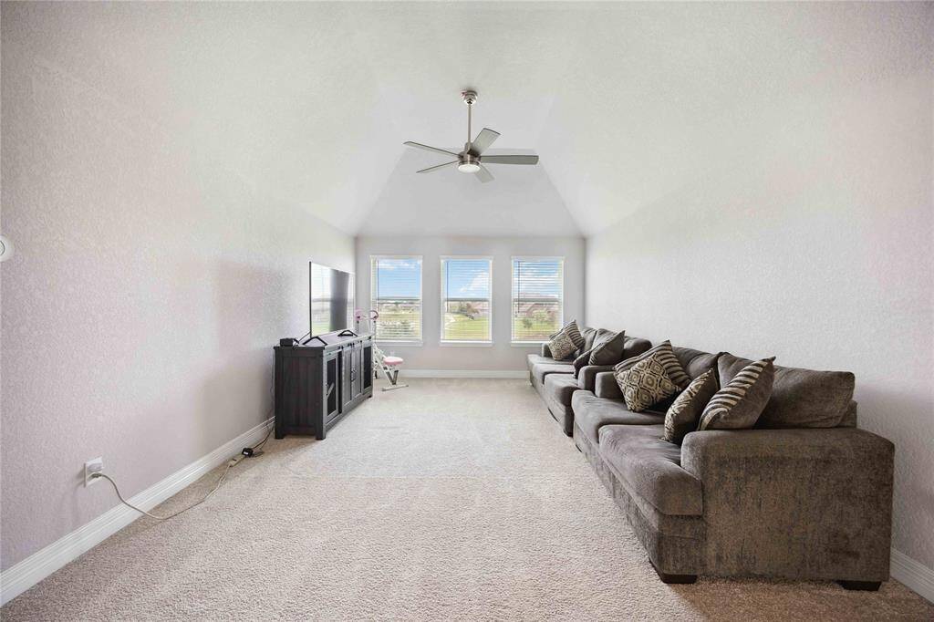This spacious upstairs Gameroom is perfect for relaxation and entertainment.