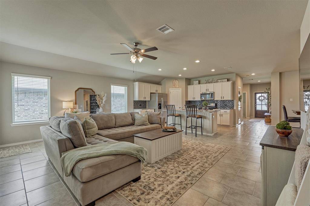 The spacious family room accommodates a large sectional sofa.  Family gatherings and entertaining are a breeze with this floor plan.