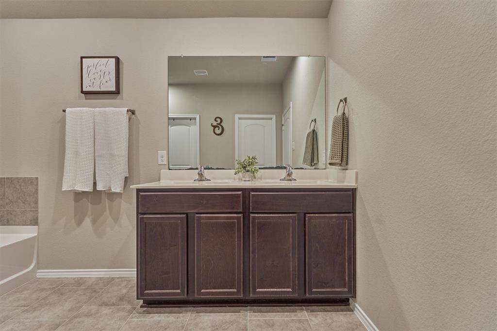 Also featured in the primary bathroom is a double sink vanity.