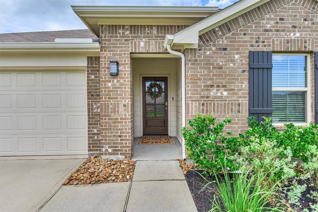 The solid wood and privacy glass door is a new addition and allows natural light to flow through the home. You'll also appreciate the gutter system which helps divert water away from the home.