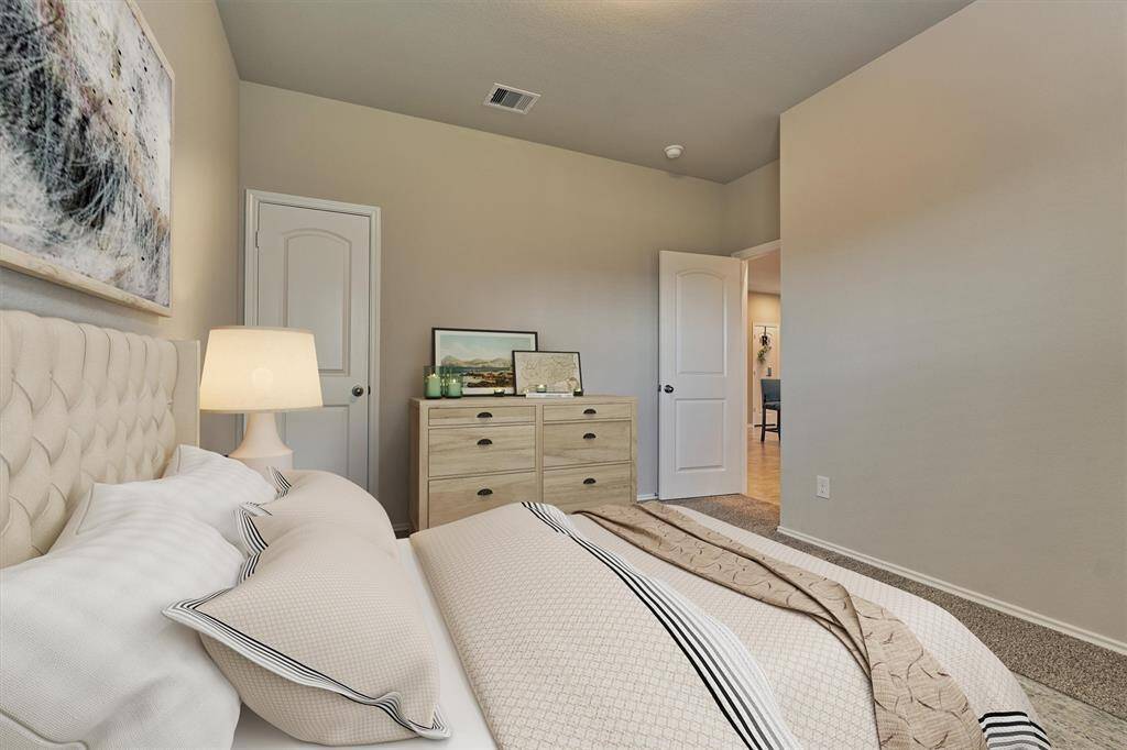 This digitally staged photo illustrates the potential of this bedroom.