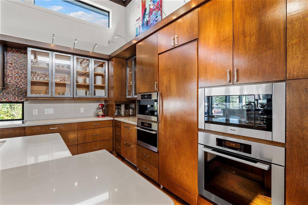 In this dream kitchen you'll find top of the line Miele appliances including a steam oven and built in coffee machine!