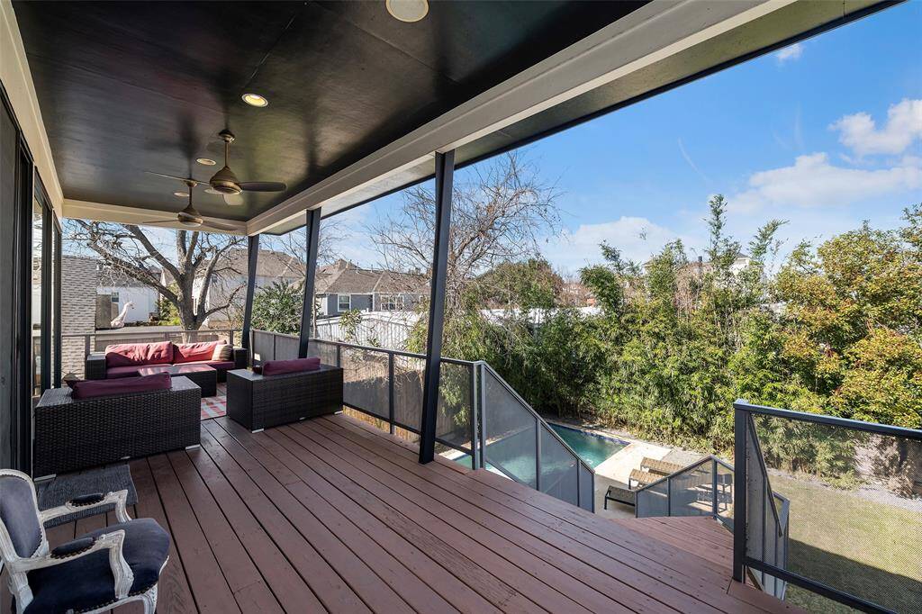 Beautiful view of the backyard oasis on this second floor balcony off of the living room. Modern stairs lead you to the spa, pool and backyard!