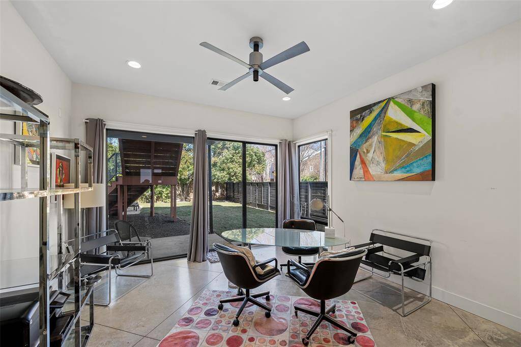 Guest bedroom located on the first floor with an ensuite bathroom, and direct pool access. Can easily be used as needed including a home gym due to its concrete flooring.