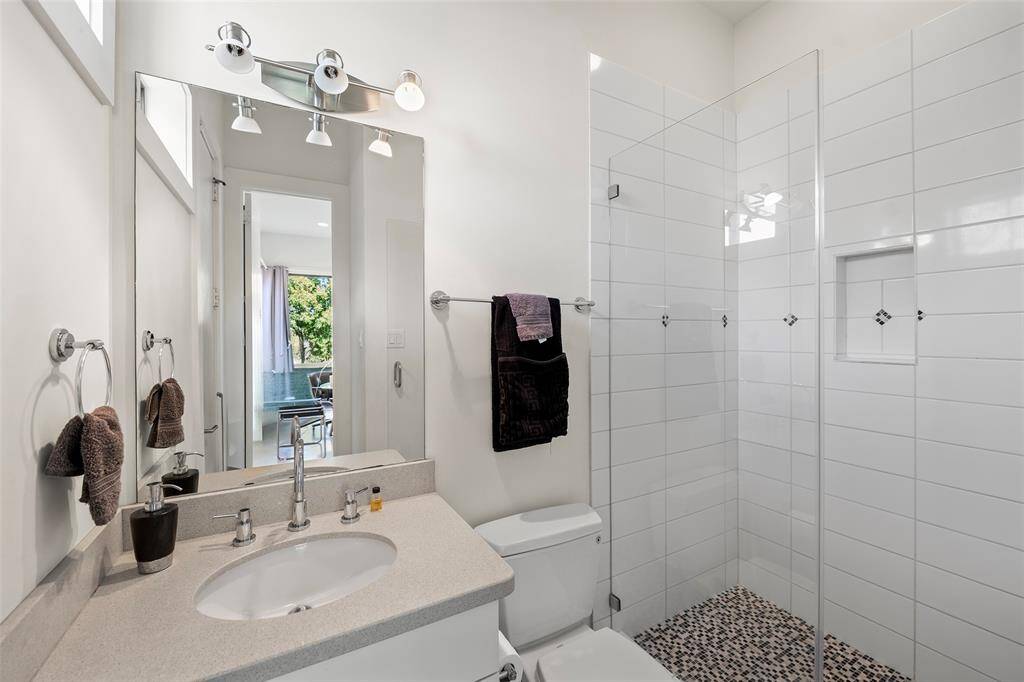 Ensuite bath on first floor with private entry from the pool area.