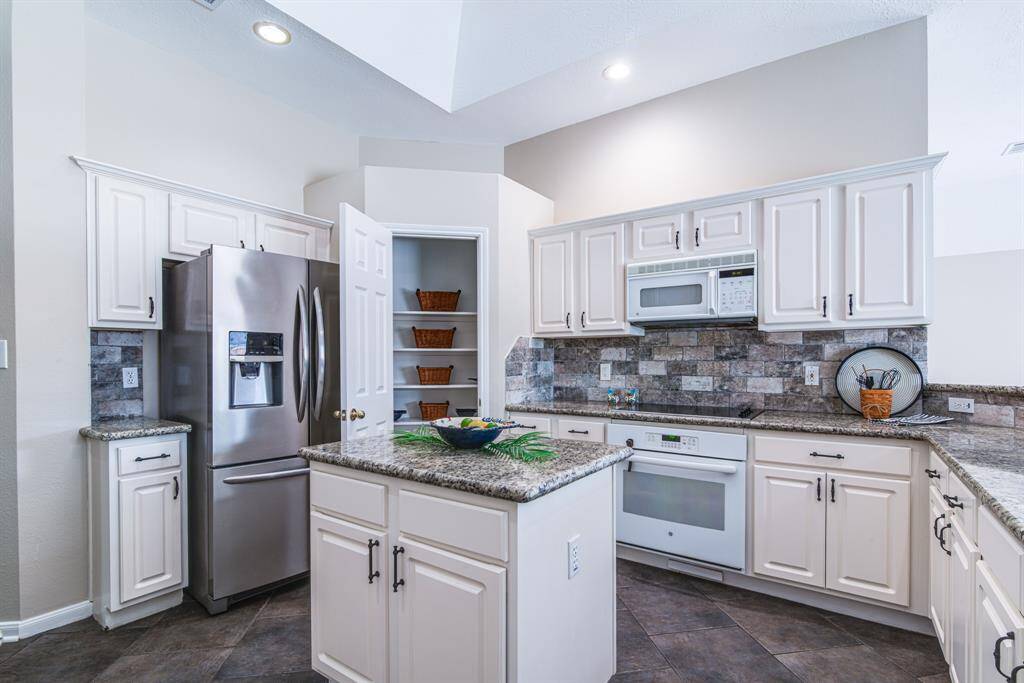Lots of storage space in this kitchen.  Notice the pantry