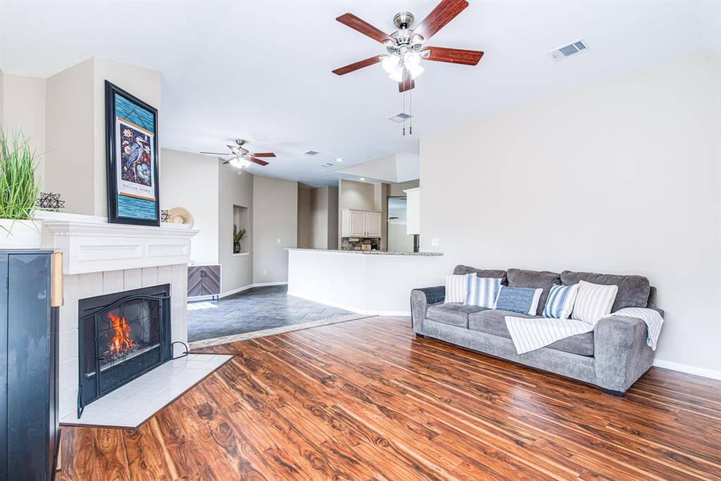 Spacious family room with lots of windows and fireplace