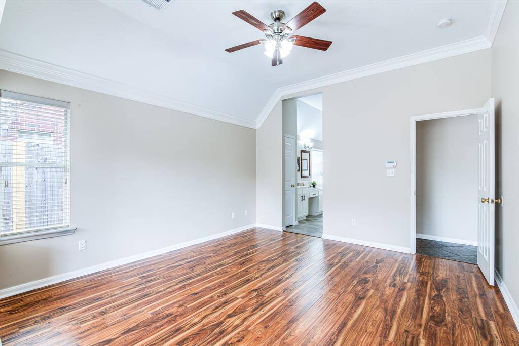 Primary bedroom with lots of windows and great light.  Attached primary bath.