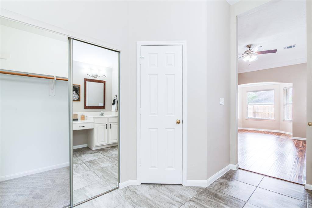 Primary bath with closet.  Tile floors in the spacious primary bath.