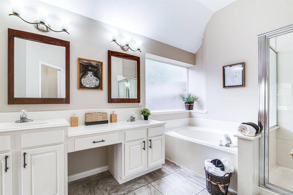 Primary bath.  Large, frosted window for great lighting.