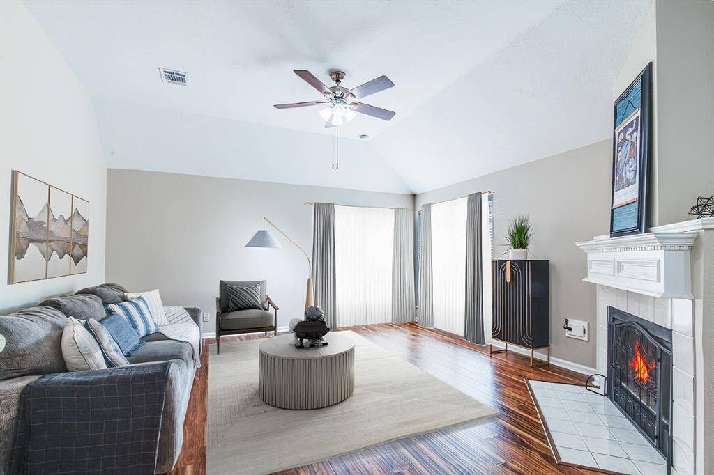 Family room with fireplace. Lots of natural light. Wonderful 2nd living space in this home. (virtually staged)