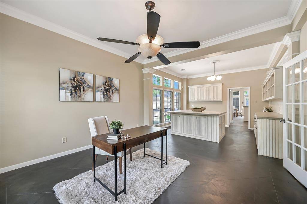 The open-concept design seamlessly connects the flexible front room to what was designed to be the formal dining room, but has been utilized as a workspace for a home business. Also perfect for homeschooling students!