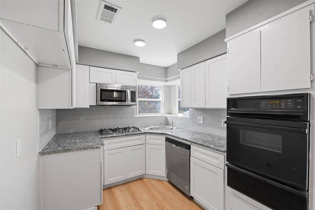 New microwave, new sink, faucet, garbage disposal, and new dishwasher. Great window overlooking the front of the house.
