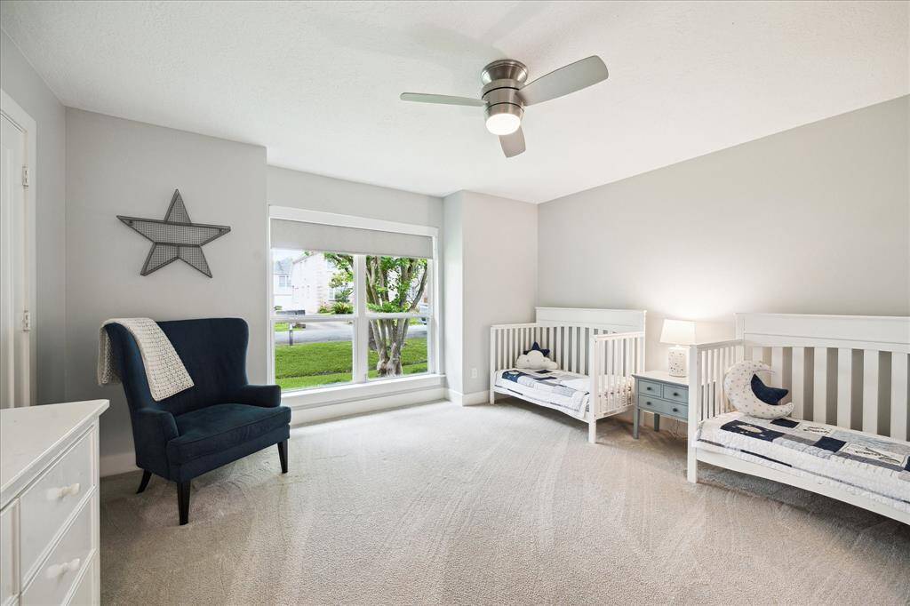 Secondary bedrooms are spacious and have plush carpeting. The double-pane windows offer quiet comfort and energy efficiency.
