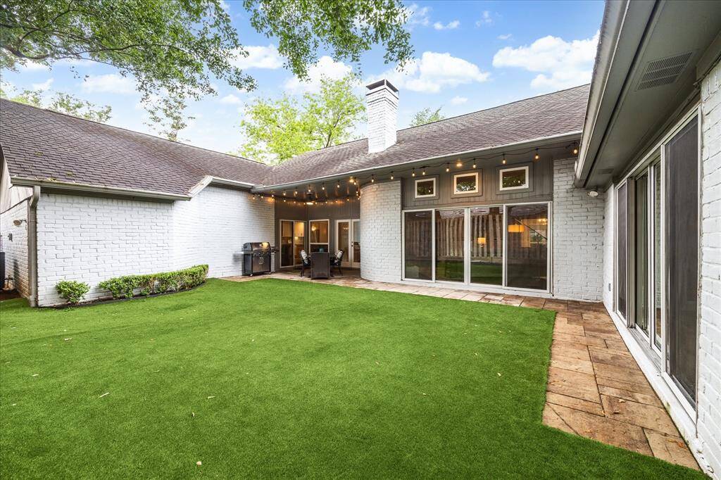 This backyard is designed for easy outdoor living, with multiple access points that seamlessly connect the indoors to the lush, private space outside. Inside, the home showcases a top-to-bottom renovation featuring new PEX plumbing, upgraded insulation, energy-efficient double-pane windows, modern cabinetry, elegant countertops, stylish flooring, updated fixtures, and so much more. Every detail has been thoughtfully selected to blend timeless design with everyday functionality.