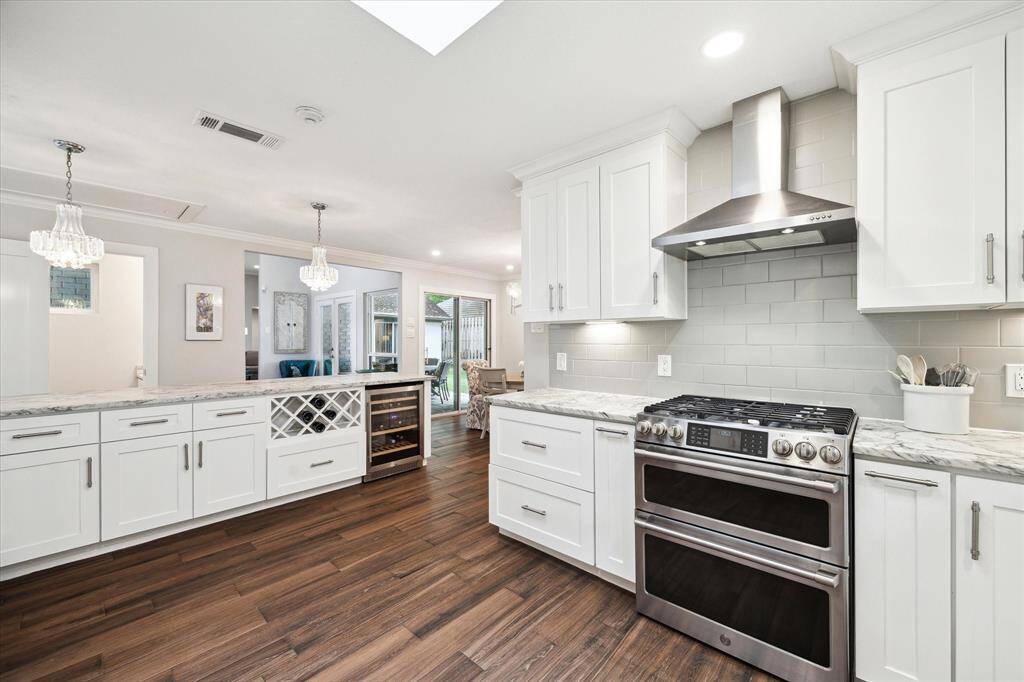 The right side of the home features a well-designed layout with the kitchen, formal dining room, sunny breakfast nook, and a utility room.