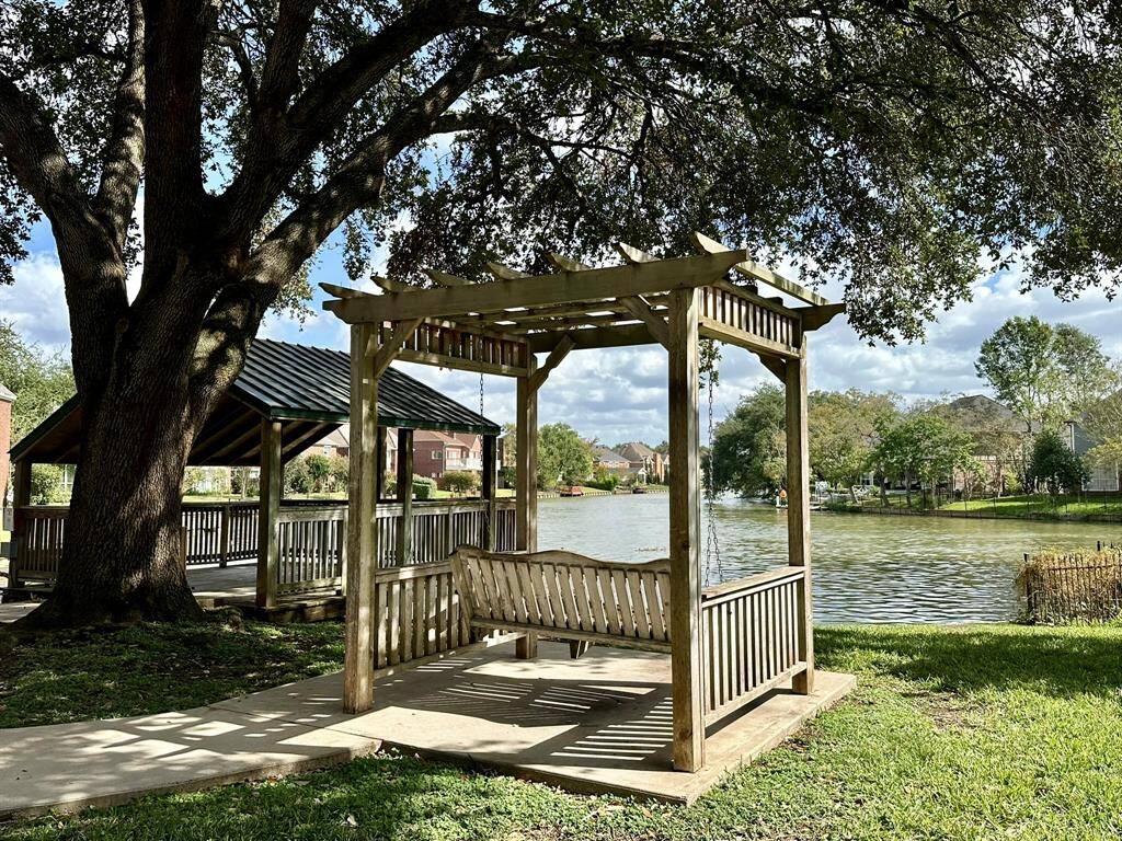 Swing and gazebo at lake in the front of Hall Lake subdivision.