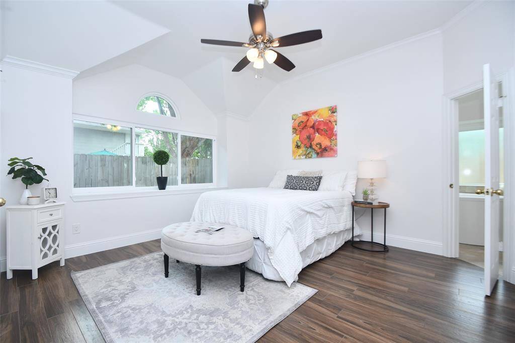 Palatial Primary bedroom with high ceilings and oversized updated energy-efficient windows