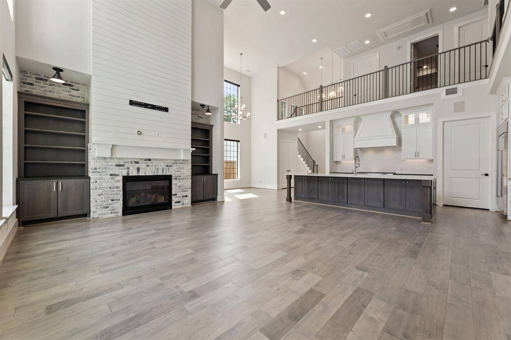Elegant shiplap accents frame the fireplace, adding charm and warmth to the living space.