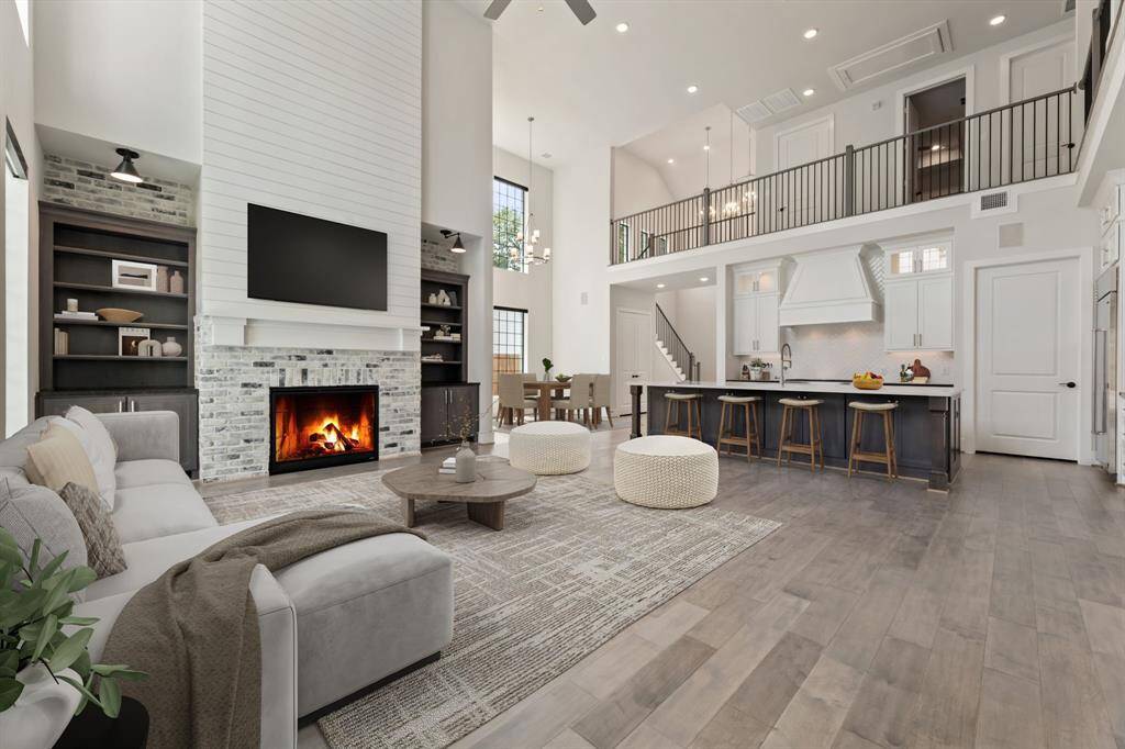 Elegant shiplap accents frame the fireplace, adding charm and warmth to the living space.