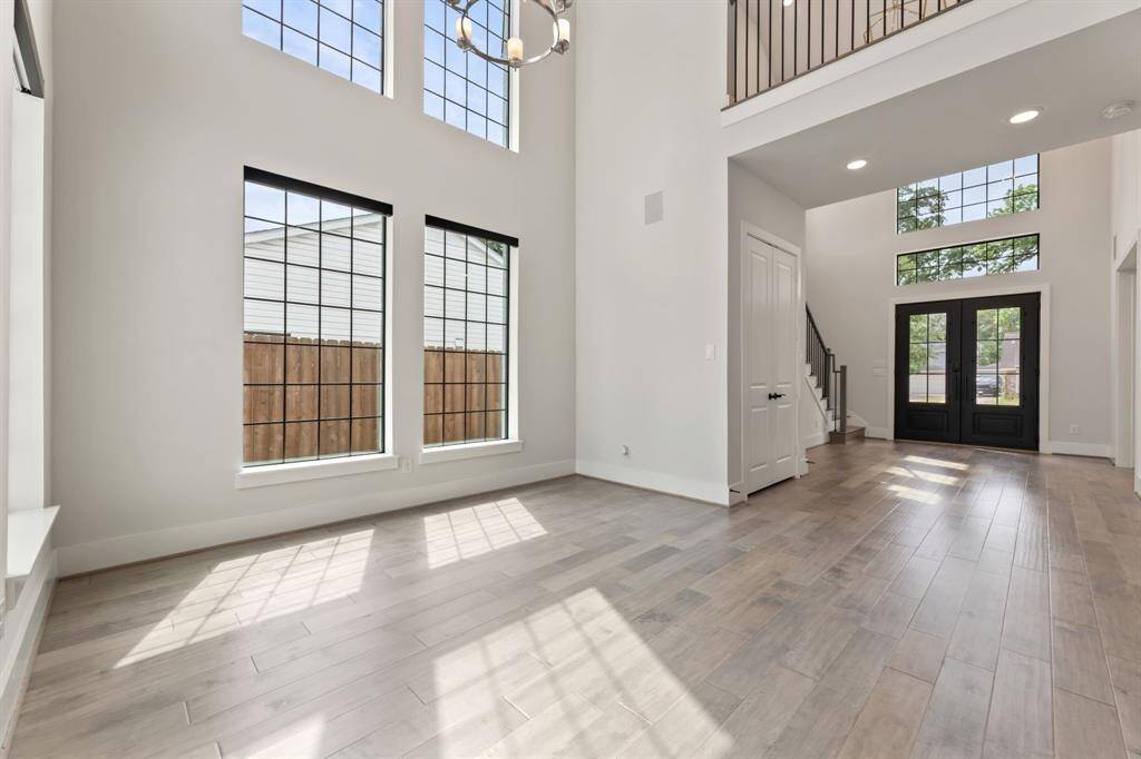 Bright and spacious dining area with high ceilings and abundant natural light.