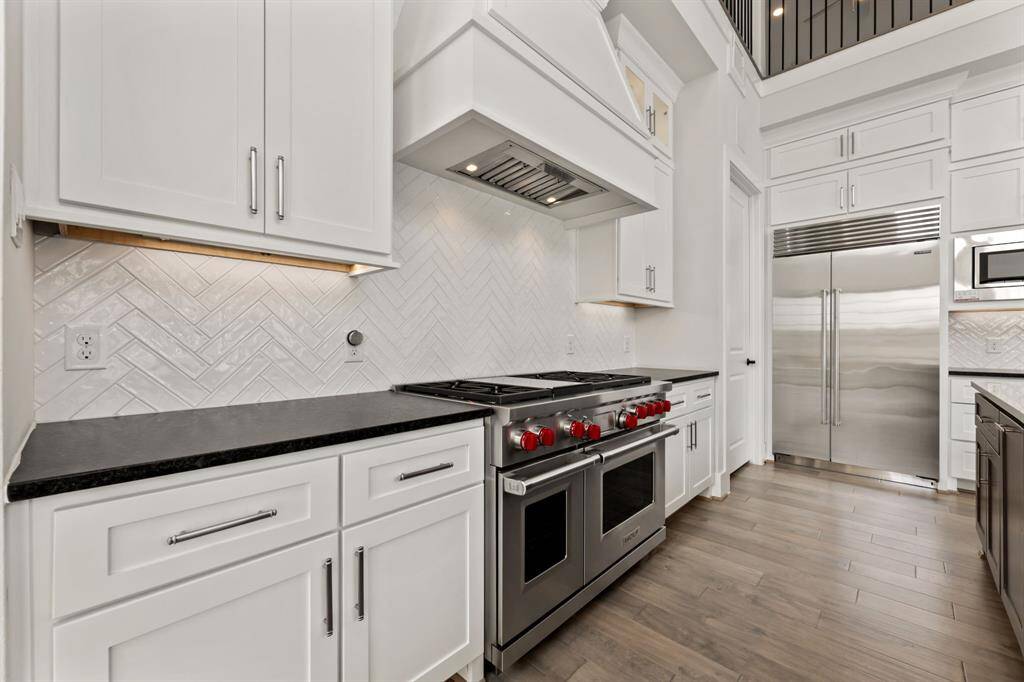 Experience culinary excellence with a premium Wolf range, blending sleek design and high performance for your dream kitchen.