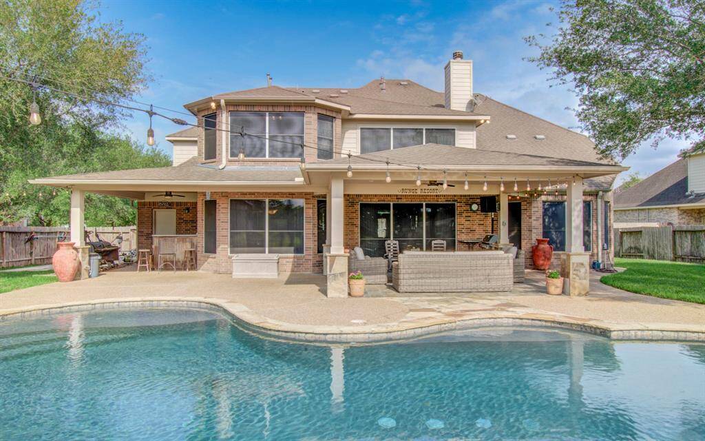 View of back patio and pool